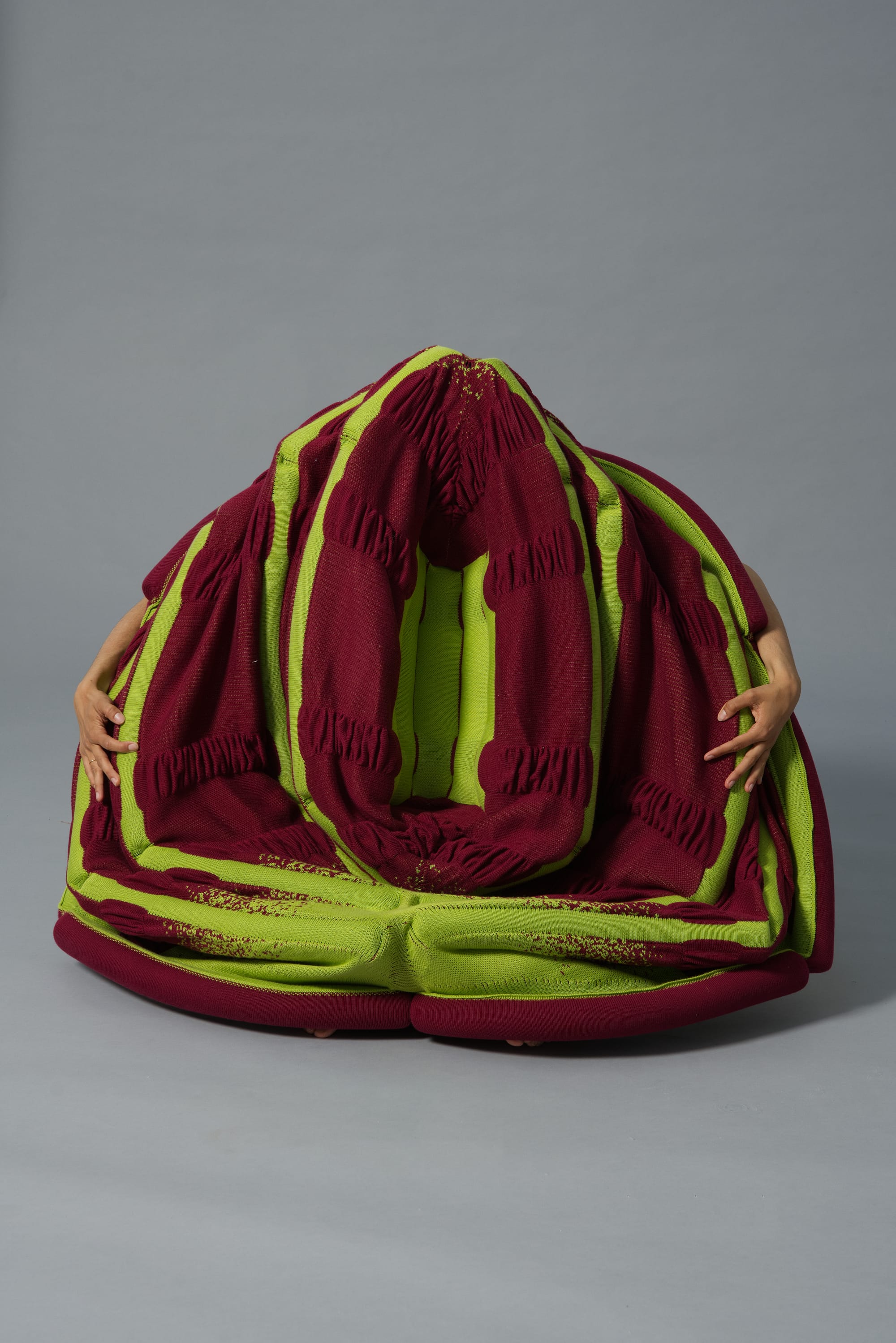 Nesphe by Luna Haverkorn. Photography by Kasper Heden Andersen. Red and green colored, multiuse, interactive furniture piece.