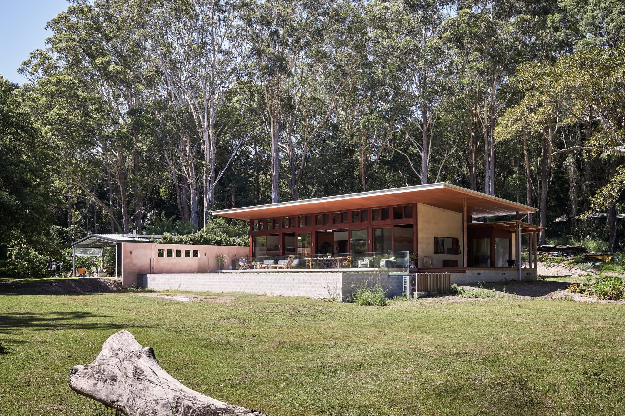 Environmentally conscious, tropical, modern hempcrete architecture surrounded by nature.