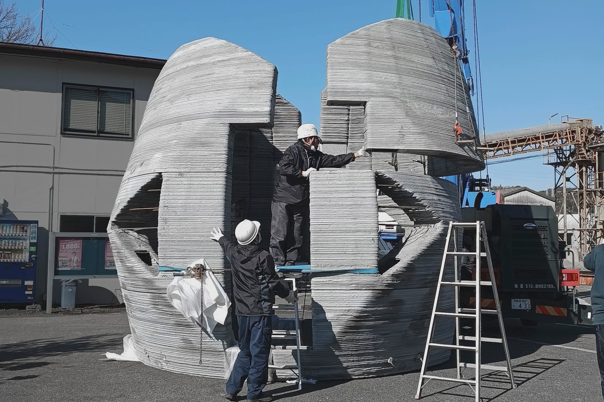 On site construction of a 3D printed concrete home made of twelve pieces.