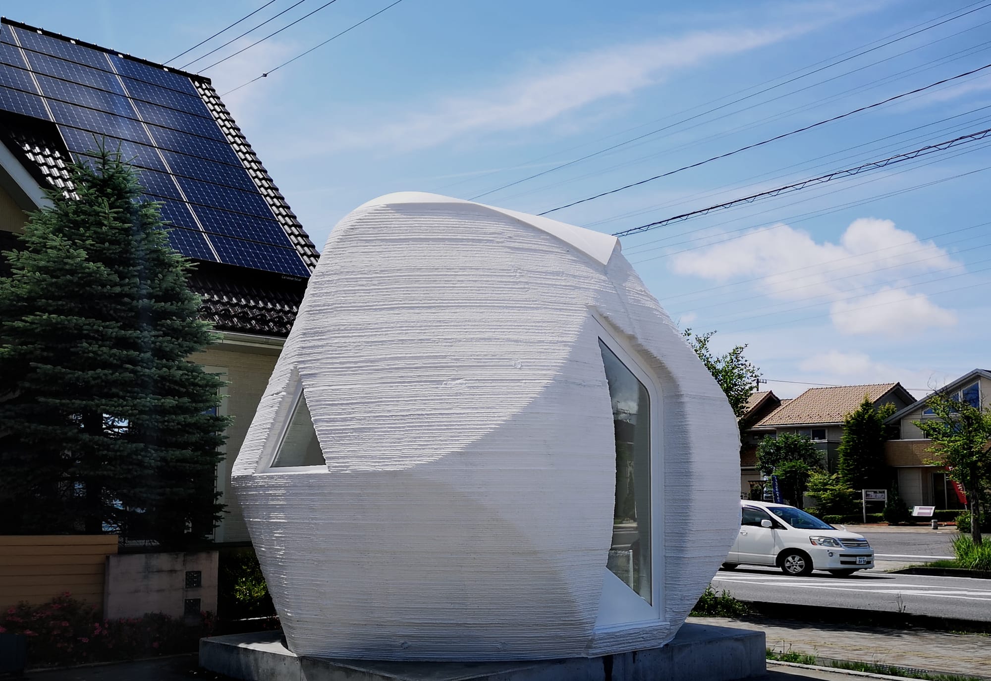 3D printed cylindric shaped, futuristic concrete home.