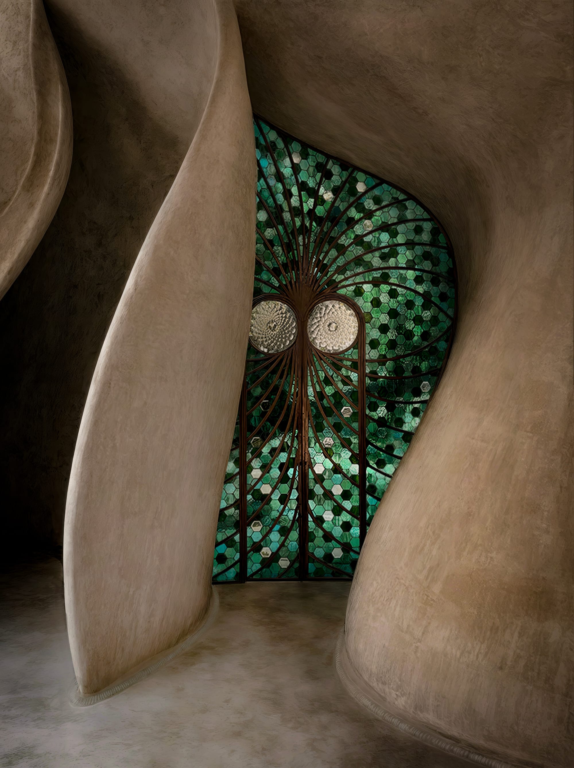 Entry door of holistic healing center with organically shaped, green, mosaic, stained glass door.