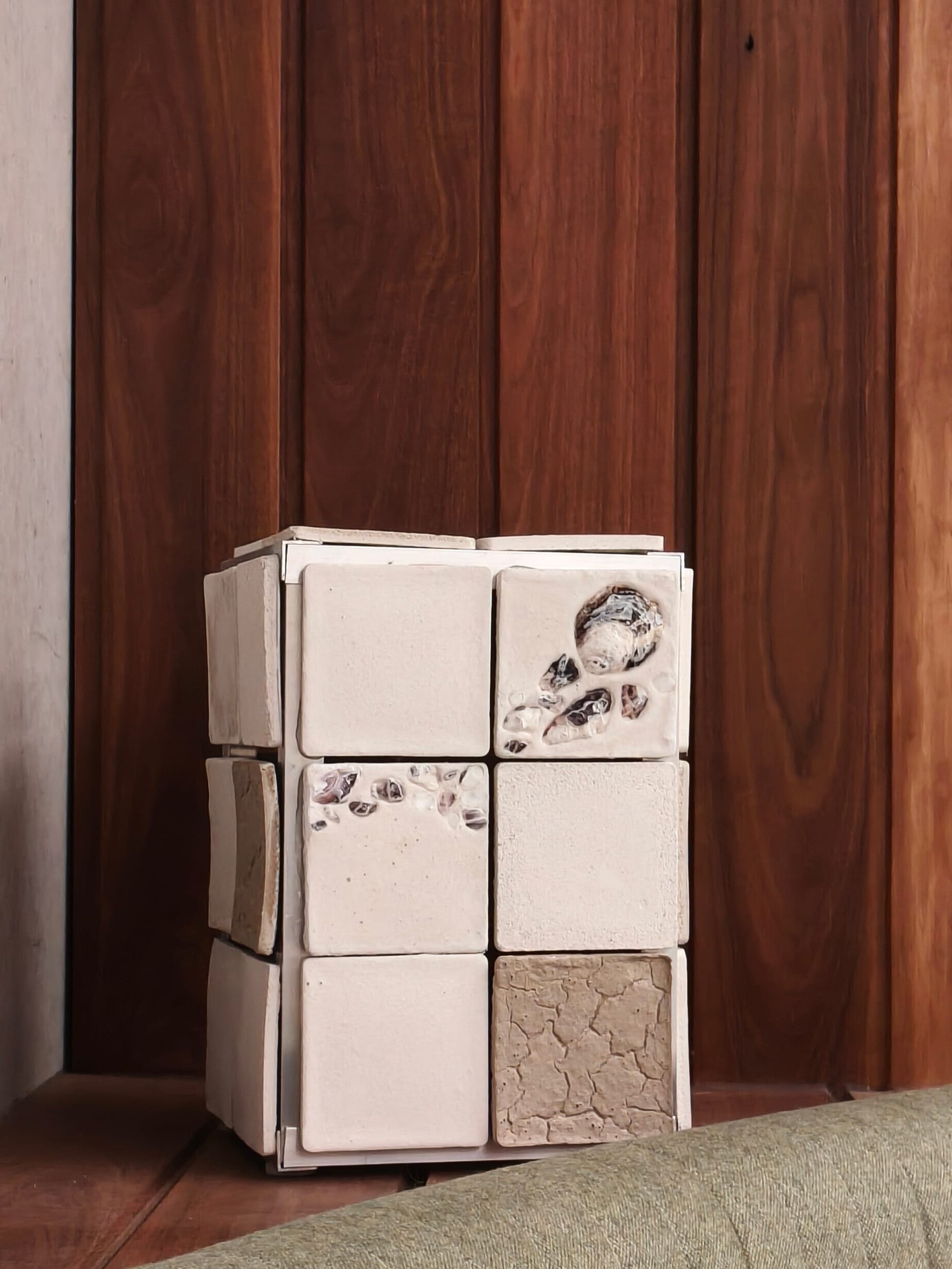 Square shaped interior lamp made of bio ceramic oyster tiles.