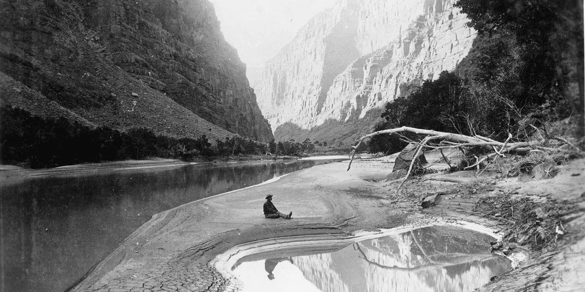 someone sitting on the bank of the Green River