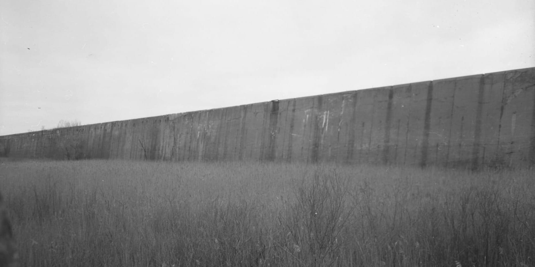 a black and white photo of one of the ore sorting walls at Steelworkers Park in Chicago