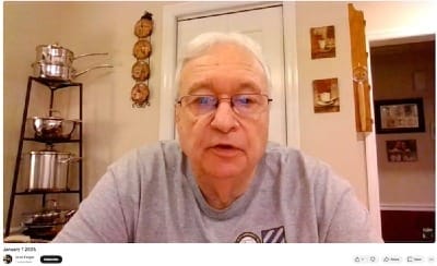 Image of a man from a YouTube video looking into camera