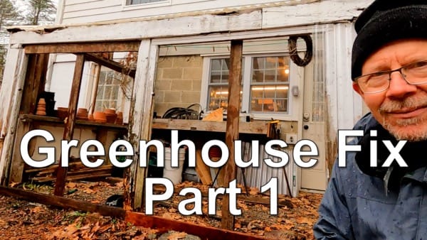 man in front of broken greenhouse