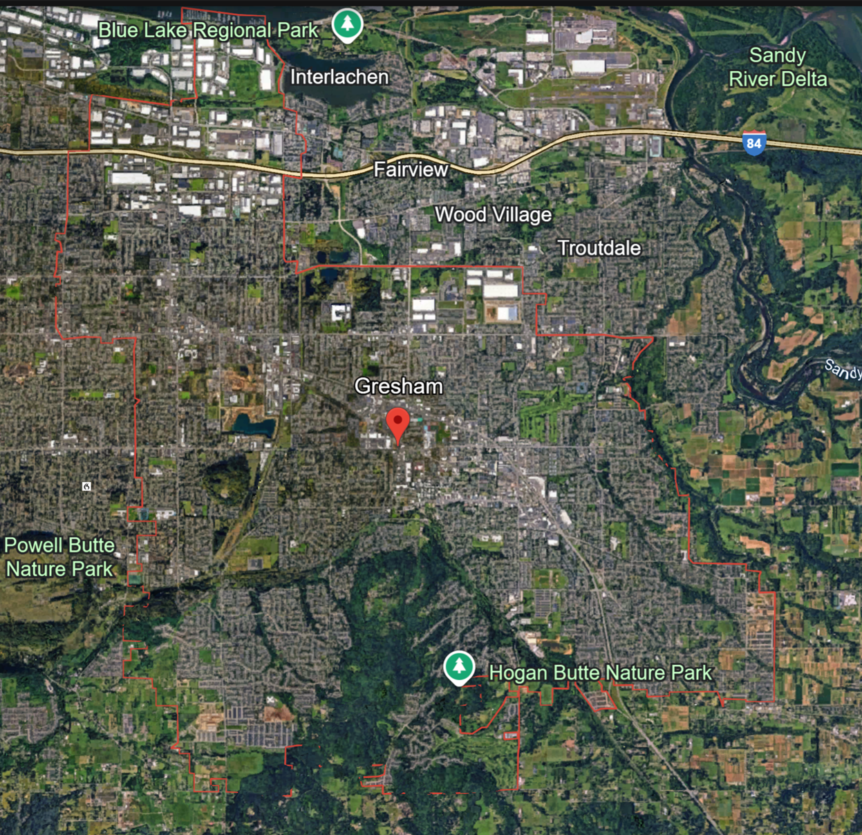 Birds eye view, satellite-style image of Gresham from Google Earth. Midsized suburb with a low sprung downtown and many suburban subdivisions. Subdivisions in the southern part of the city bump up against wooded areas and farms.