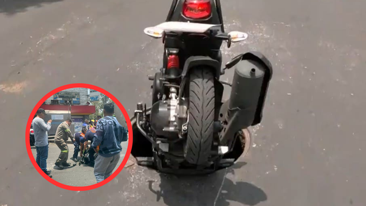 Motociclista cae a coladera destapada y resulta lesionado