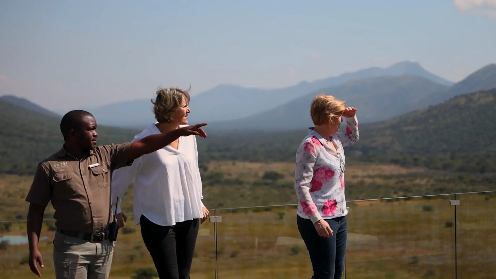 Vikki Jackson and Sian Loehrer with a guide, looking out over Qwabi Private Game Reserve