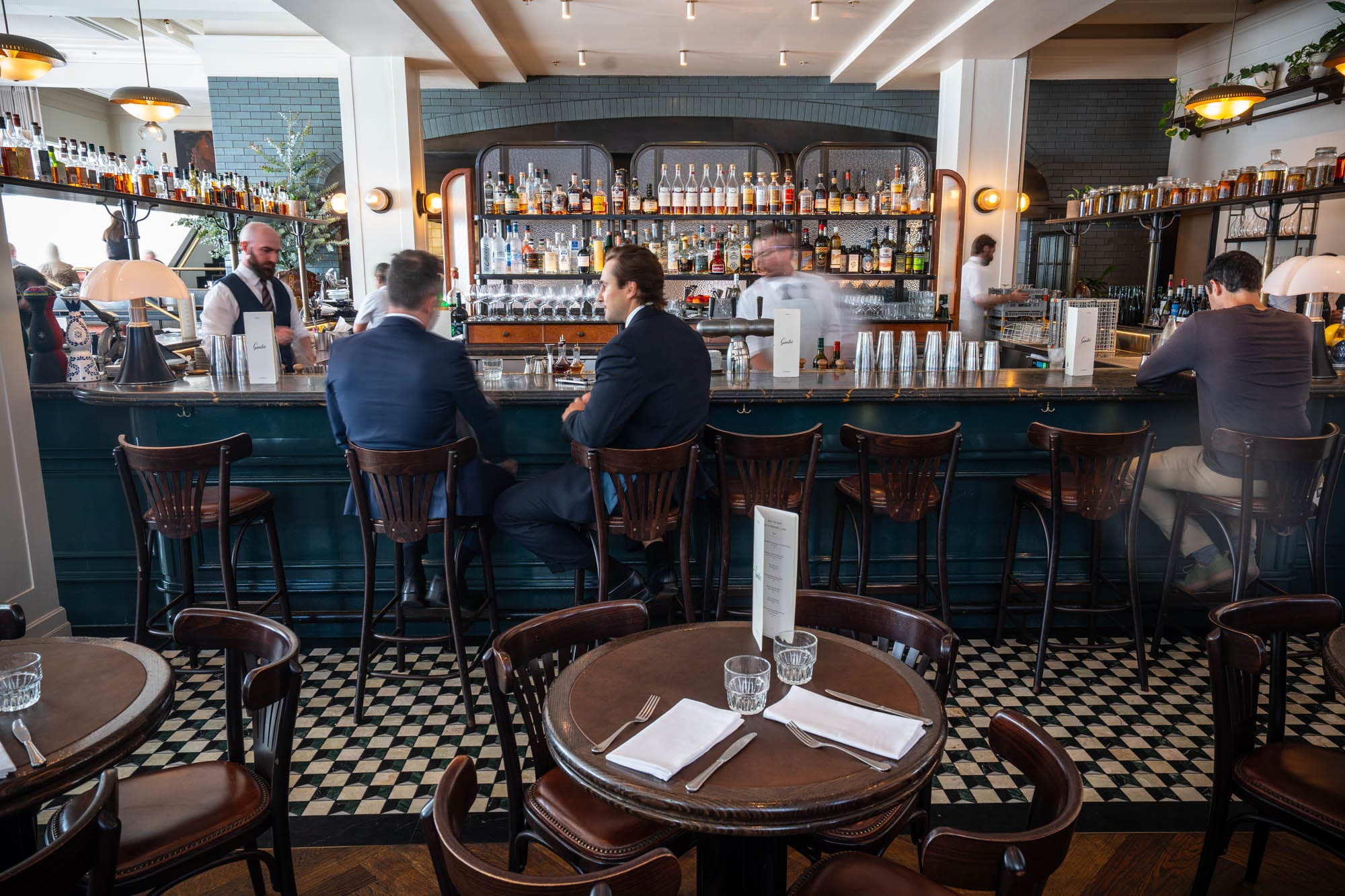 You’ll want to sit at the bar to not just enjoy the drinks, but watch the show. Photo: Fred Siggins