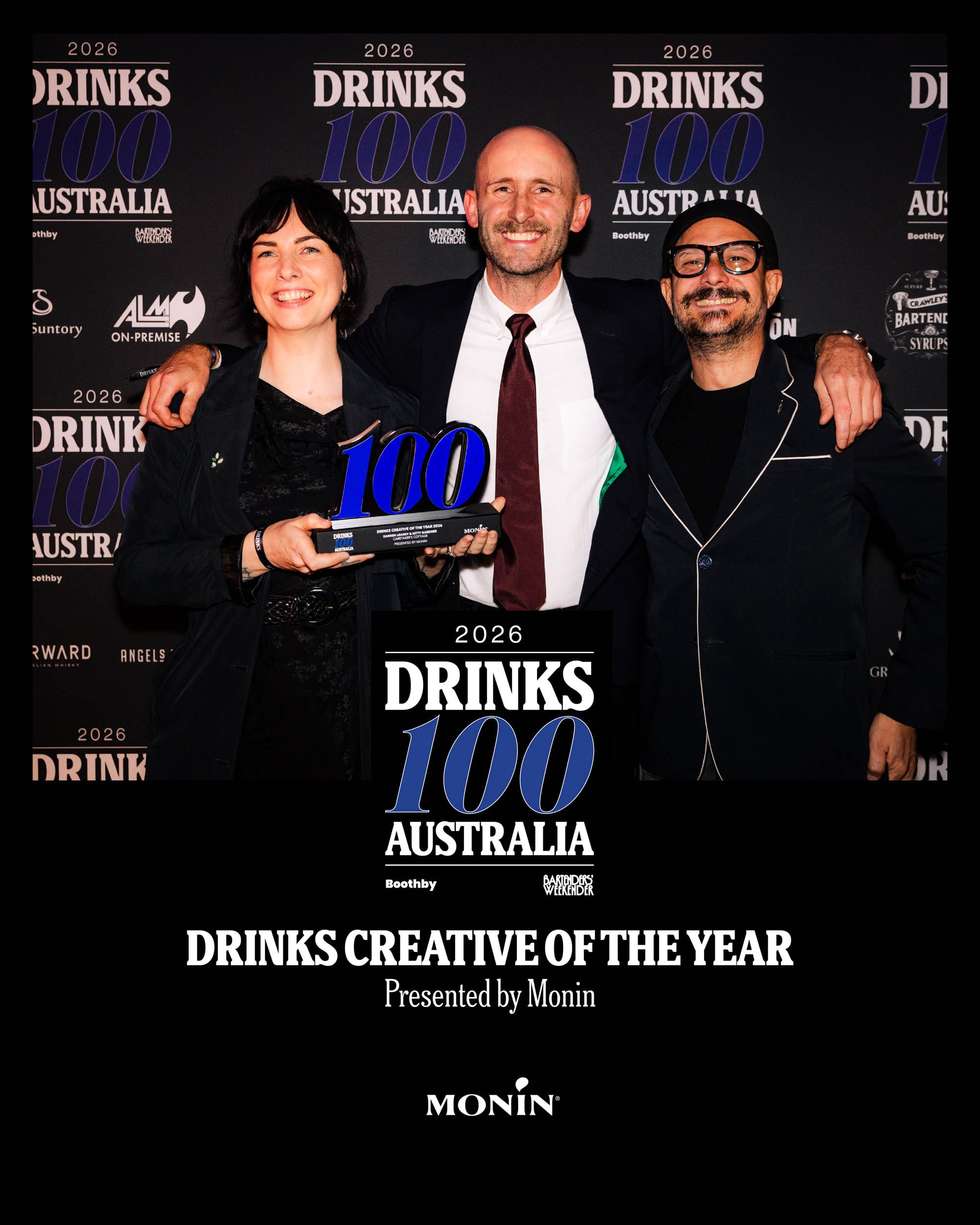 Kitty Gardner & Darren Leaney accept the award from Monin's Karel Reyes.