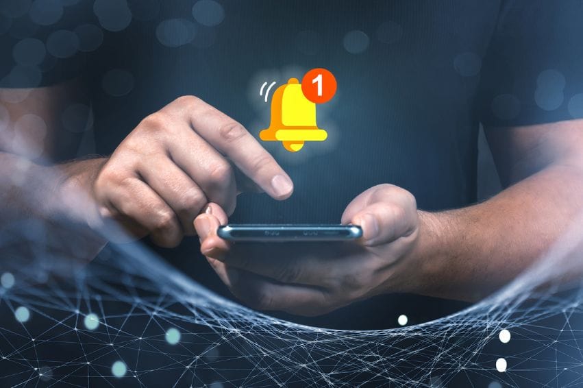 Man holding phone and touching with virtual bell for E-mail with notification alert