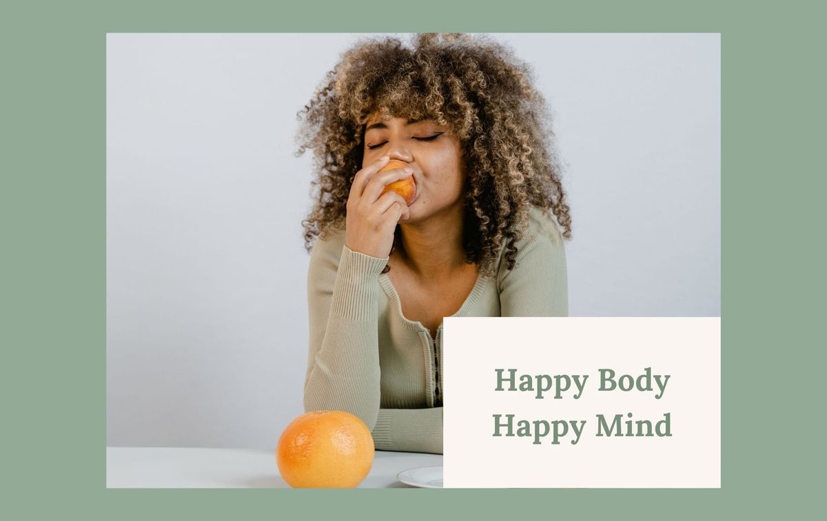 Woman eating some orange fruit
