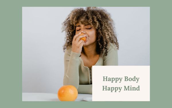 Woman eating some orange fruit