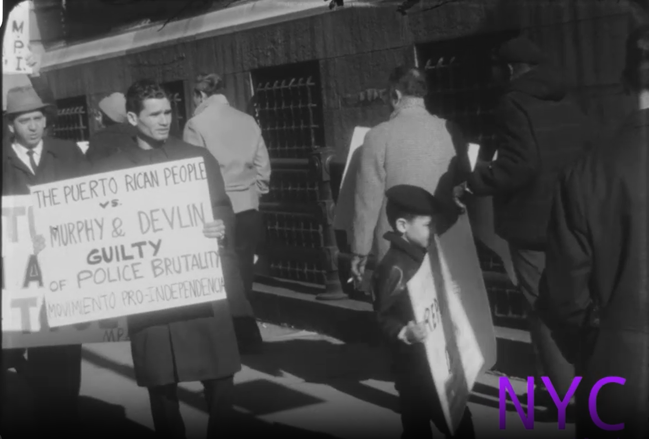 Protestors march for Puerto Rican independence and against police violence, specifically identifying Murphy and Devlin in brutality cases.