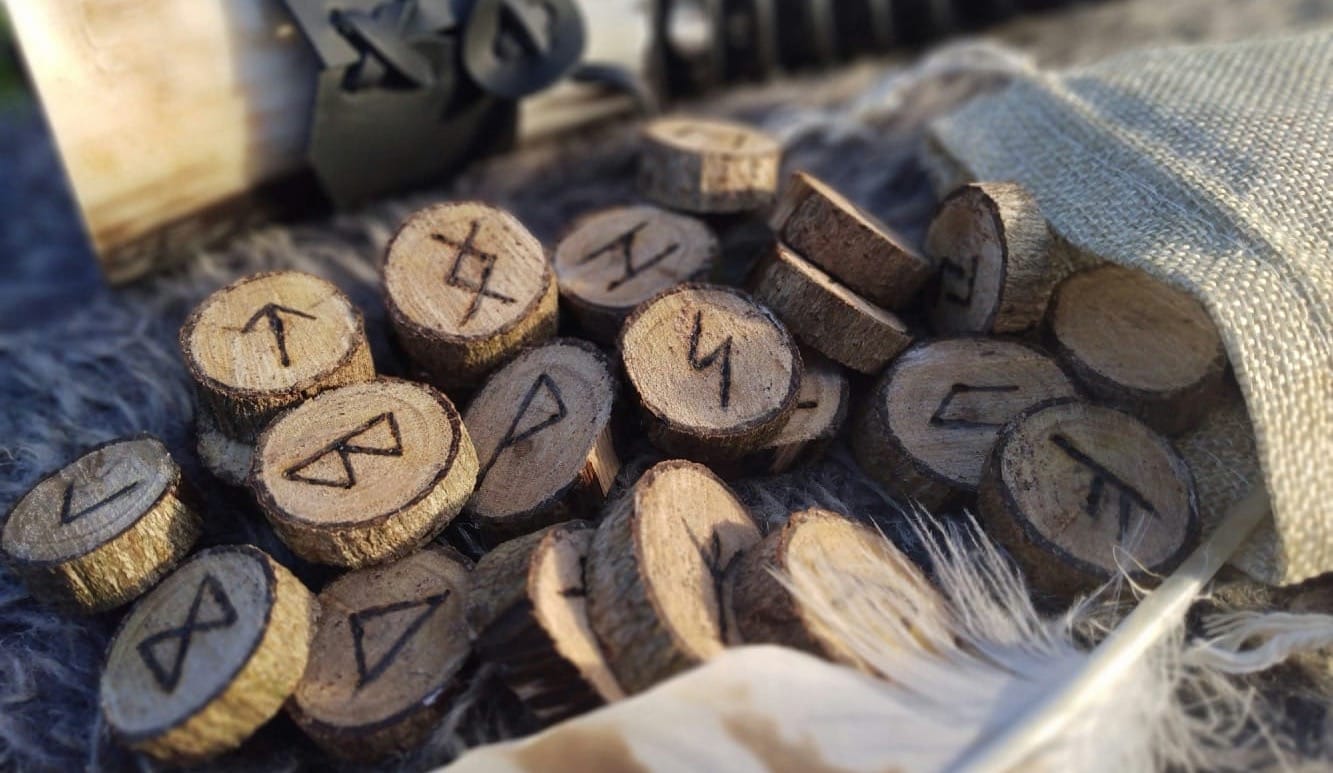 a bunch of wood pieces sitting on top of a pile of feathers
