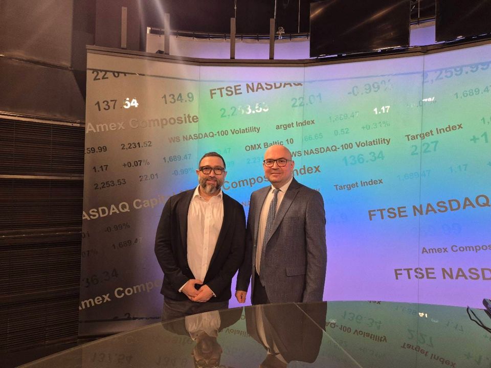 Two interview participants standing in the Bloomberg TV Bulgaria studio.