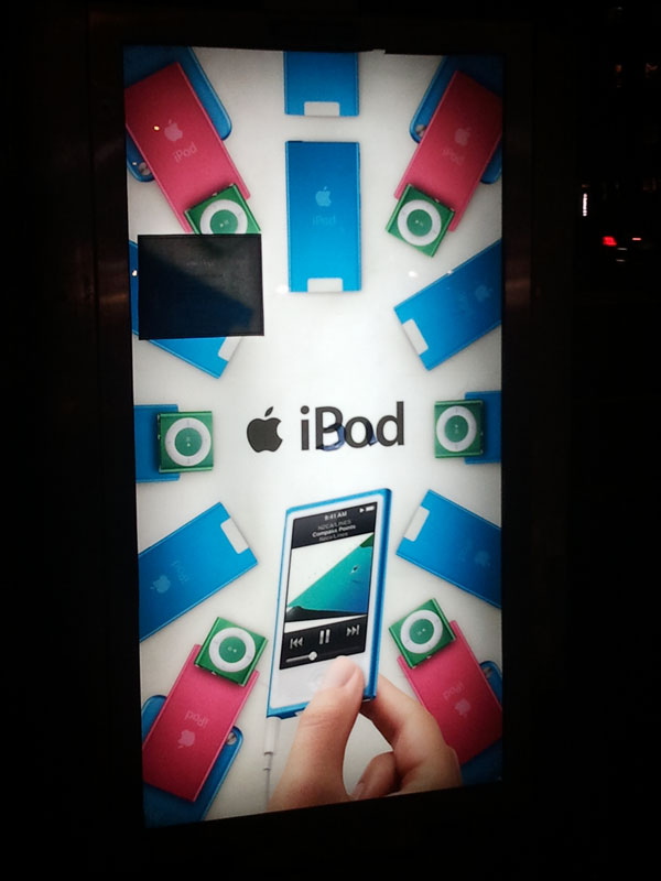 iBad--graffito on iPod ad, NYC bus shelter, December 2012