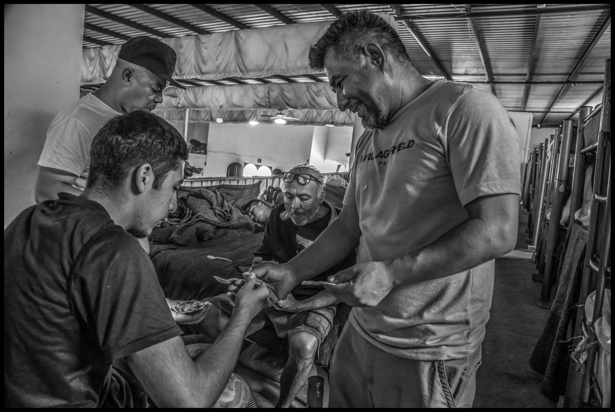 Refugees at a casa de refugio, or sanctuary home, administered by the Templo Embajadores de Jesús in Tijuana. The casas are for refugees from other countries or parts of Mexico where people have fled violence or poverty. Some are deportees from the United States. All photos © David Bacon.
