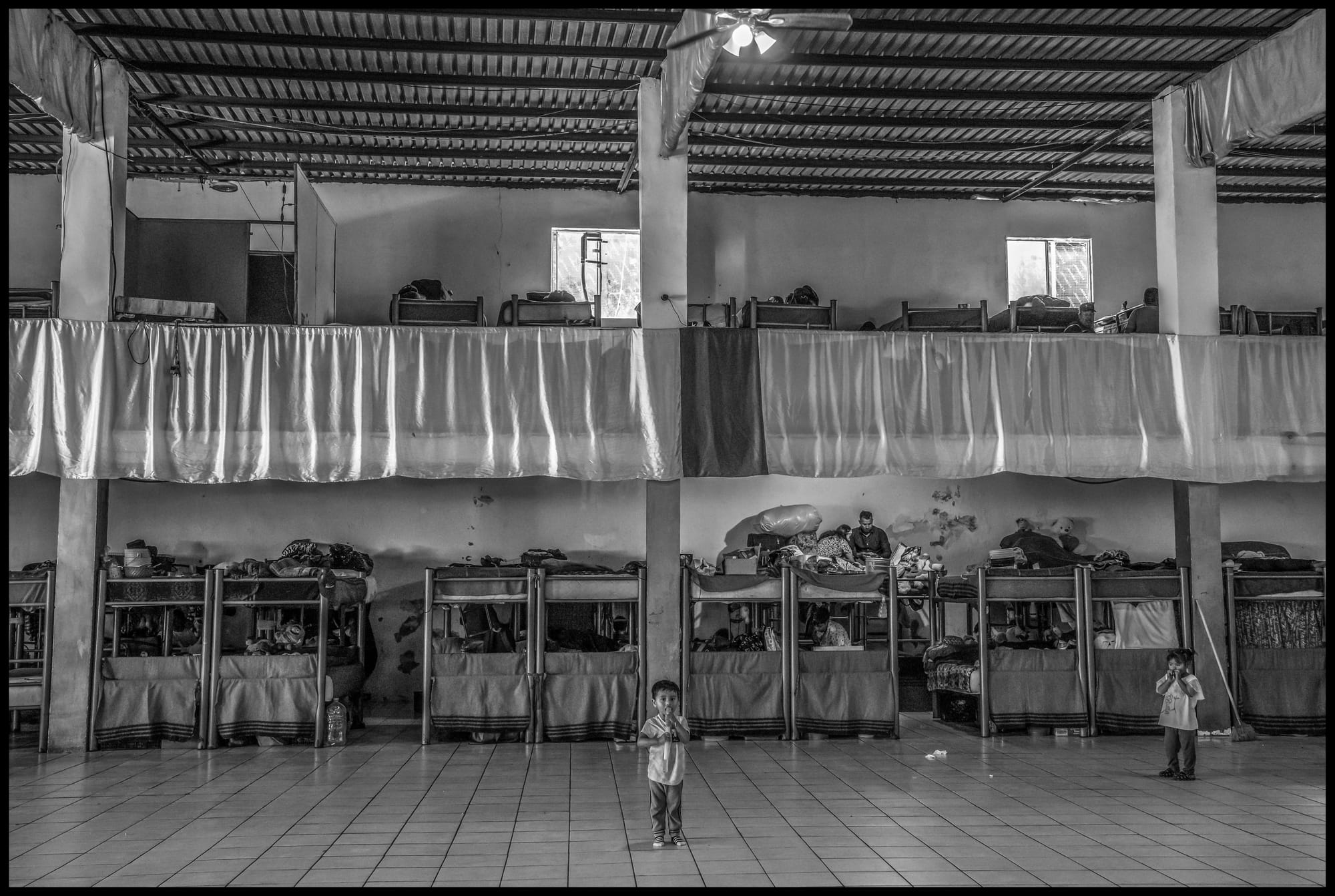Children at the casa de refugio administered by the Templo Embajadores de Jesús in Tijuana.  All photos © David Bacon.