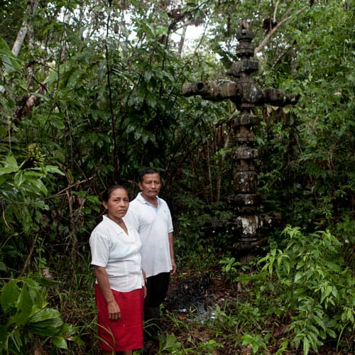Manuel Alvarado and Carmen Vargas. Tiputini is one of the three oil fields ready to be exploited should the ITT initiative fail. The tap from the test drilling is planted in the Alvarado family’s backyard, and is oozing crude oil, contaminating their soil and groundwater.