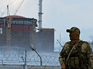 a Russian soldier by the Zaporizhzhia nuclear power plant
