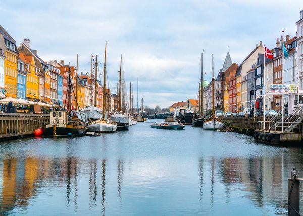 Boats in canal in denmark during daytime