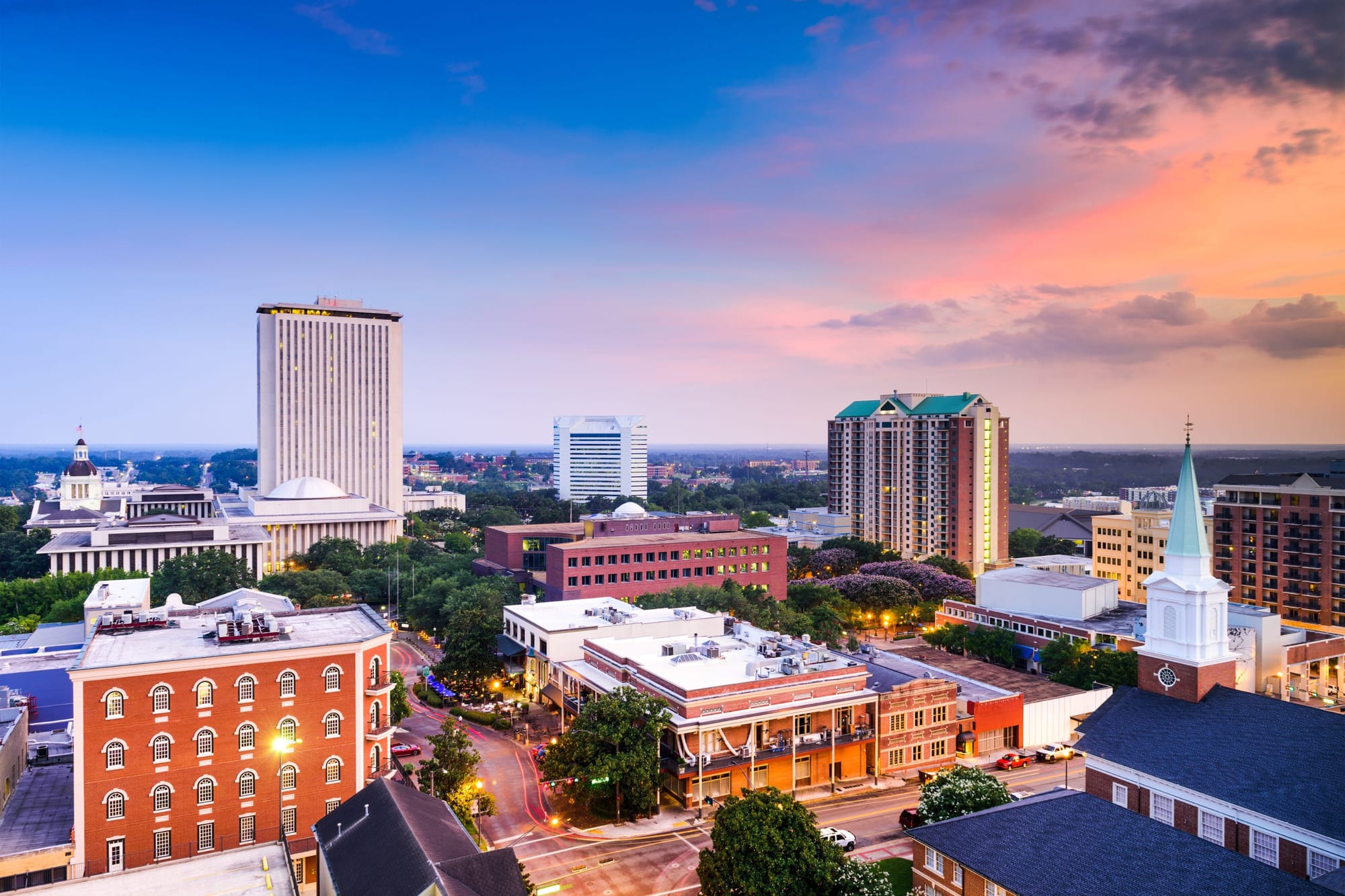 An aerial view of the city of Tallahassee, Florida at dusk.