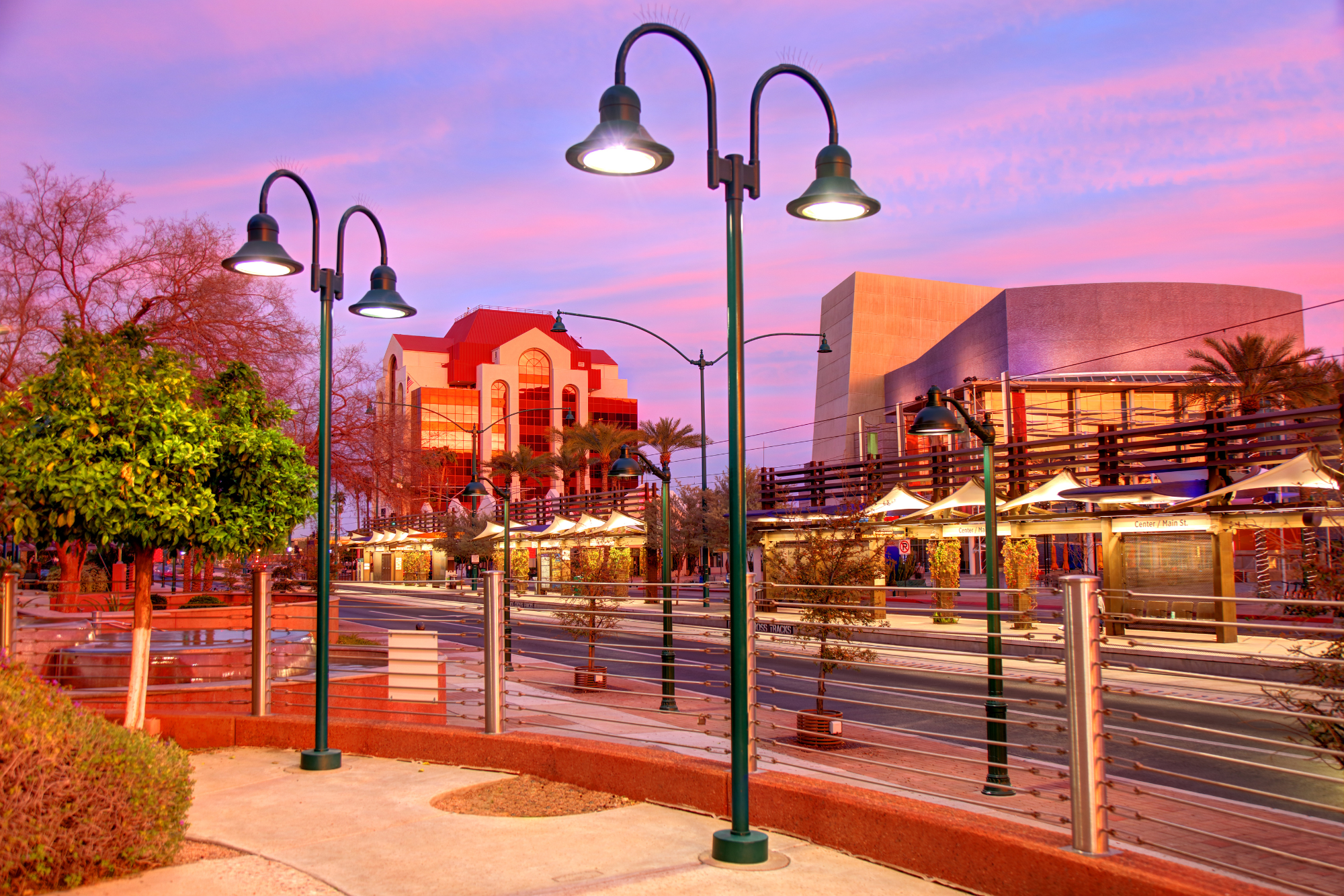 A vibrant sunset over a street in downtown Mesa, Arizona