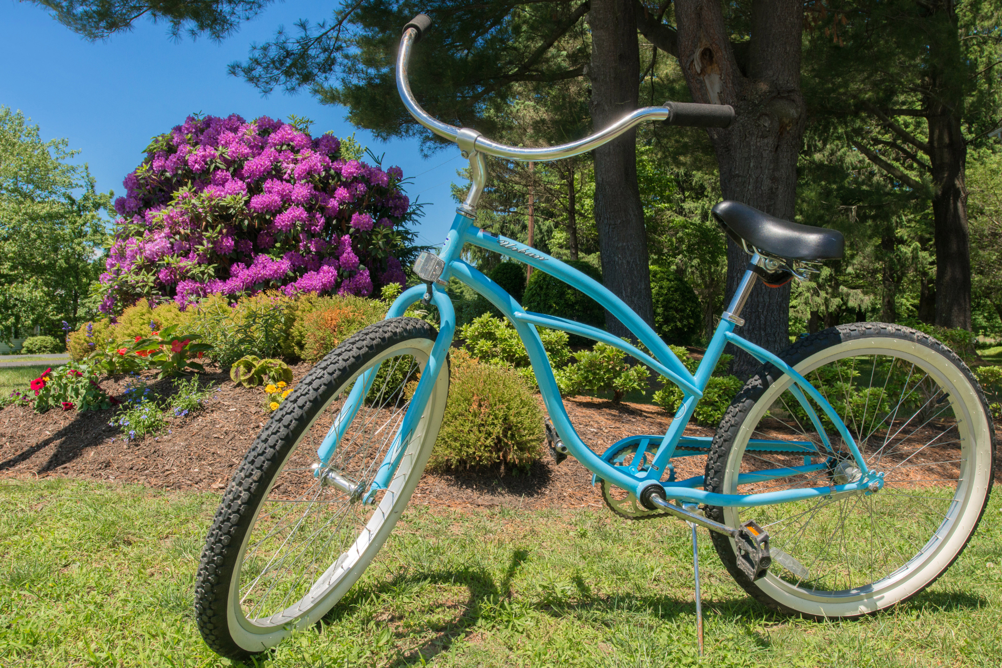 An up-close shot of a bike in a lush landscape, one of the bicycles available to sign out at no cost to residents at Sugarloaf Estates.