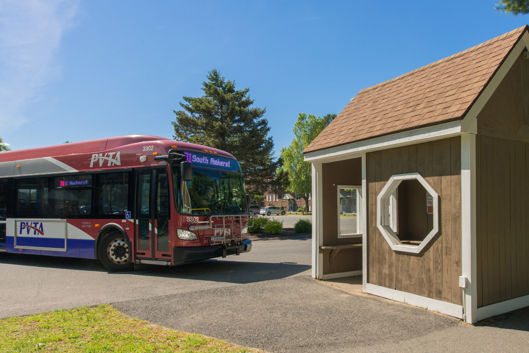 A PVTA bus pulled up next to the bus stop station located right outside of Sugarloaf Estates Apartments.
