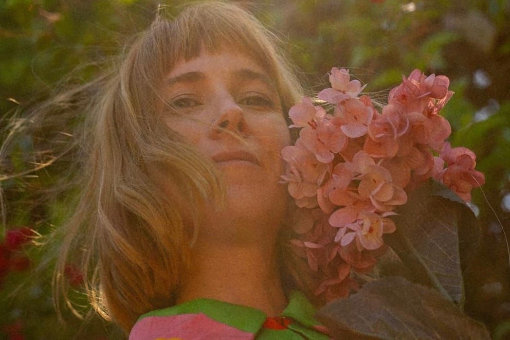 Katie Schottland portrait with Flowers