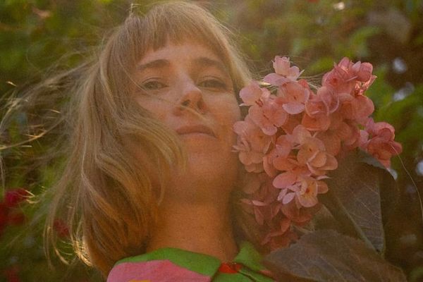 Katie Schottland portrait with Flowers