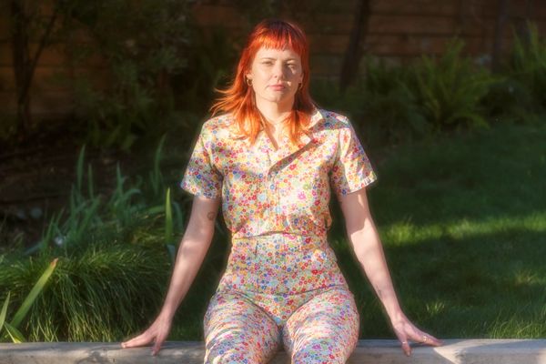 Mary-Cait Henze sitting on a wall