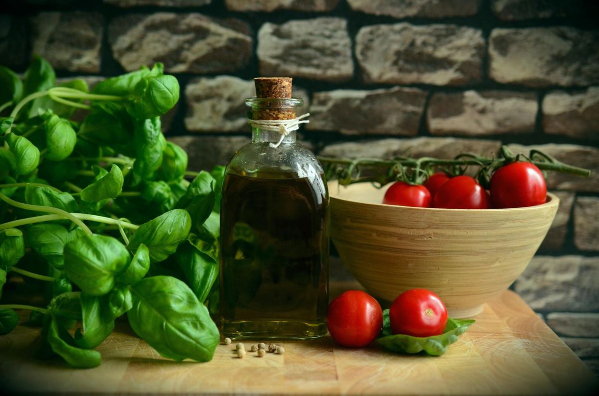 Mediterranean diet — olive oil, leafy greens, fish, nuts — promoting cognitive health and active longevity