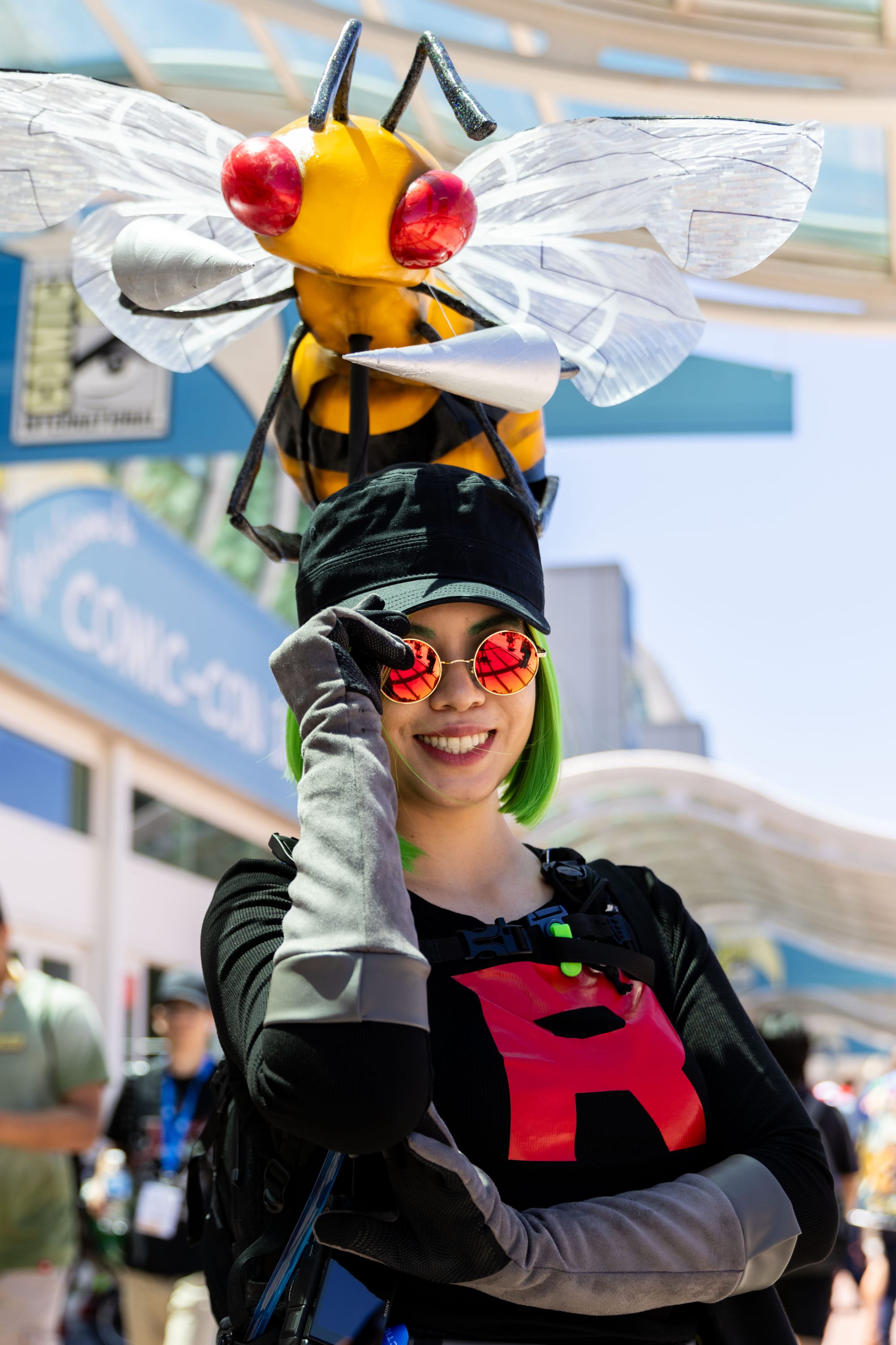 someone dressed in a costume with a giant bee on their head