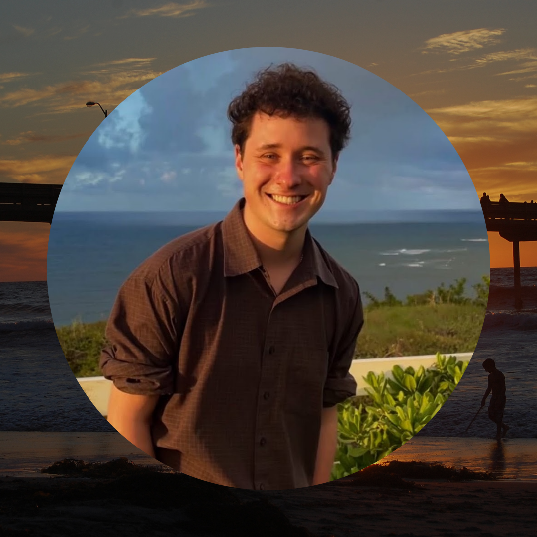 A person smiles in a sunset picture outside