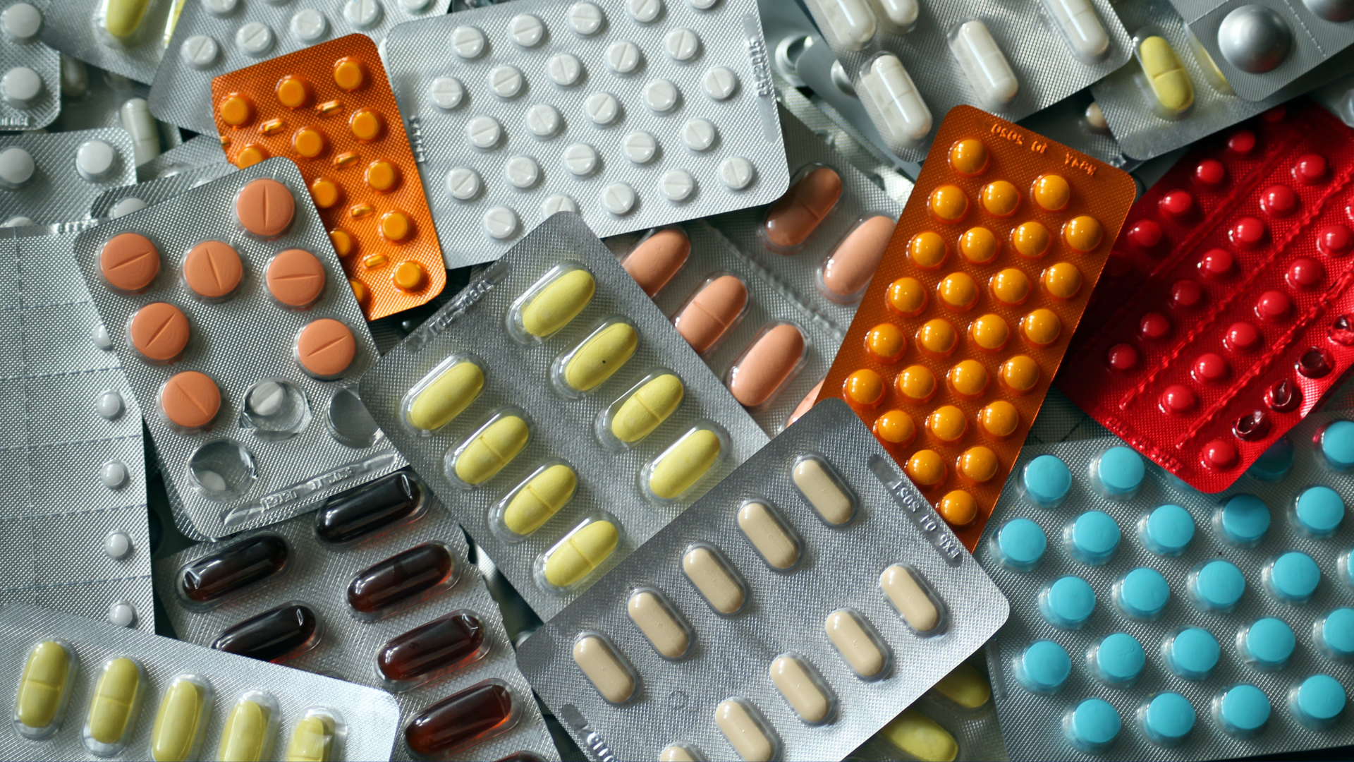 Packages of pills lie on a surface