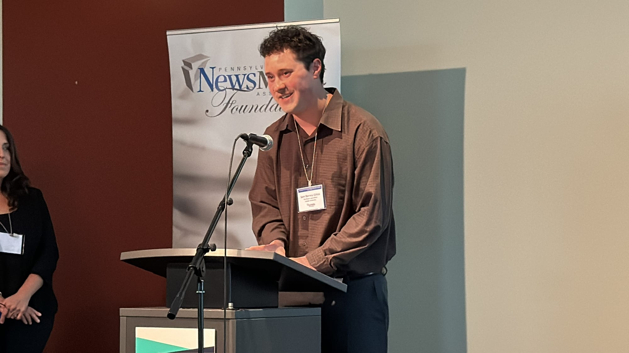 A person stands at a podium giving a speech