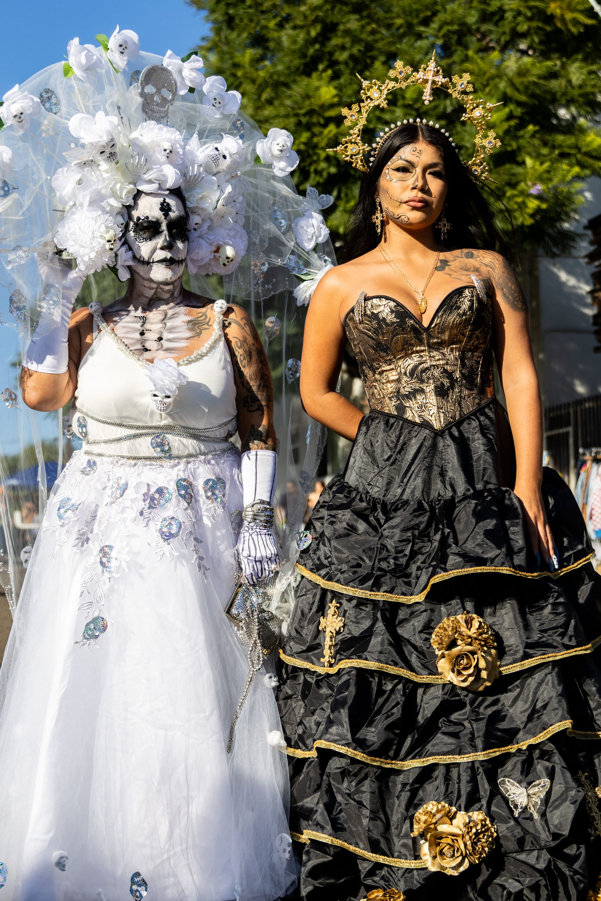 Two women stand next to each other. 