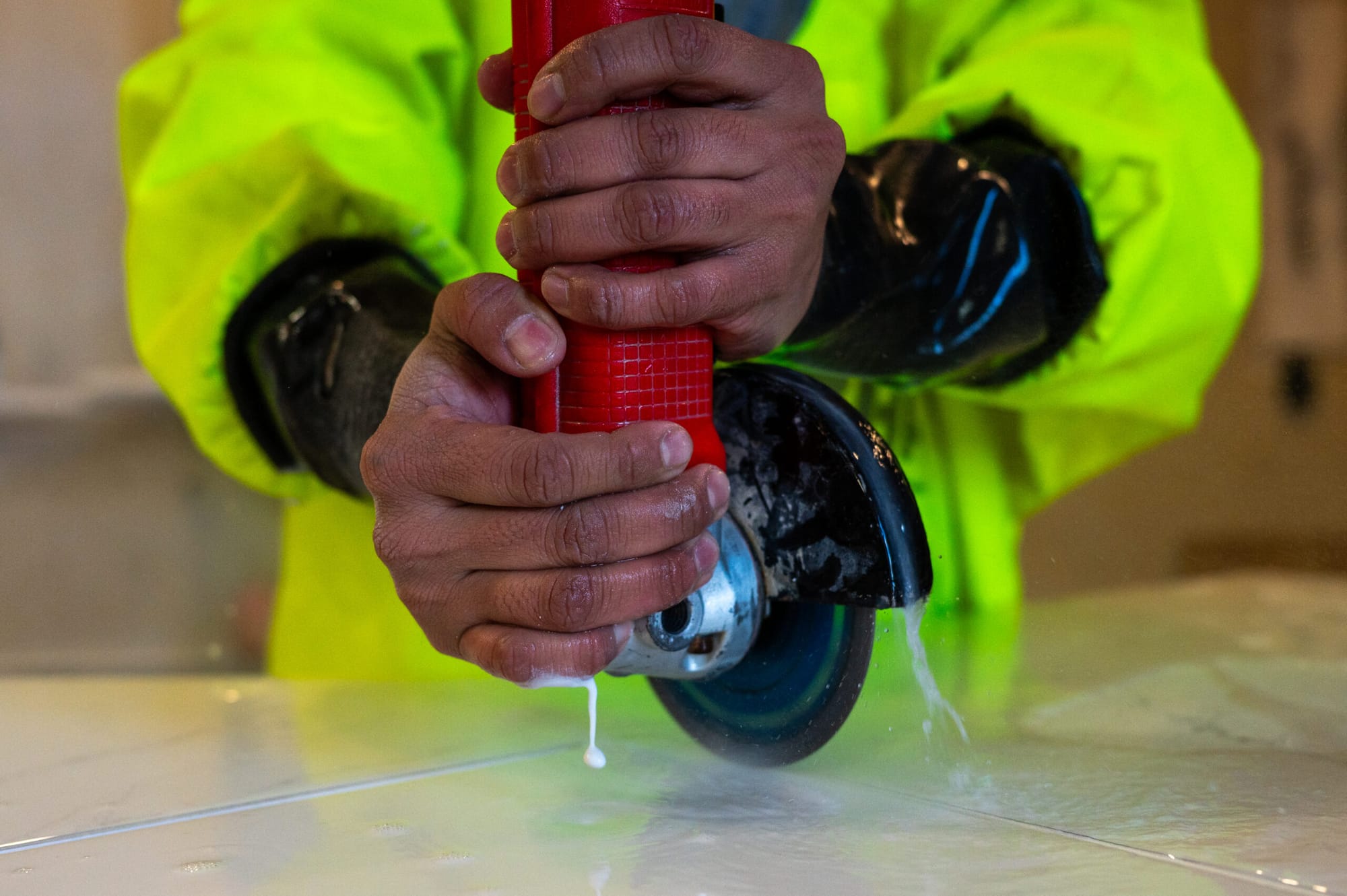 Closeup of hands using a saw