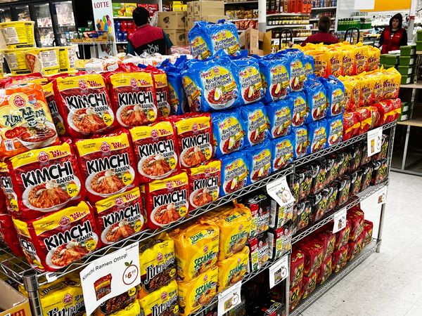 Picture of a display rack full of ramen at a grocery store.