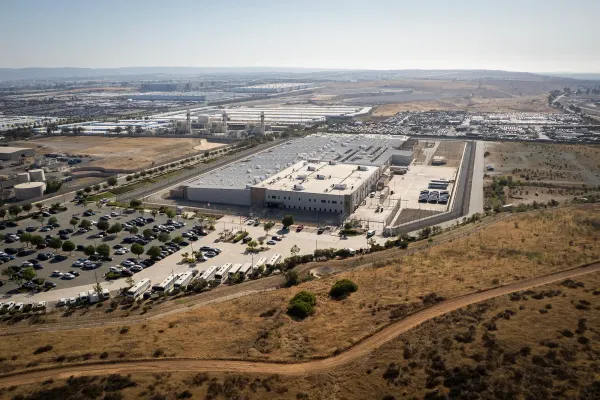 A prison building and parking lot seen from above