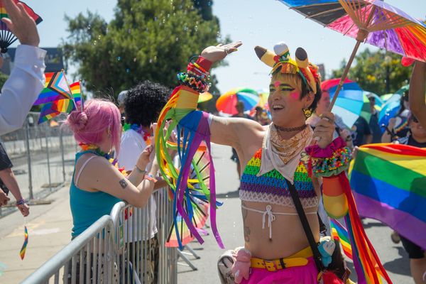 Rainbow flags, umbrellas and fans fill the streets of Hillcrest during San Diego Pride
