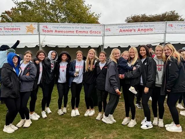 Winchester girls lacrosse team fundraises for Buddy Walk