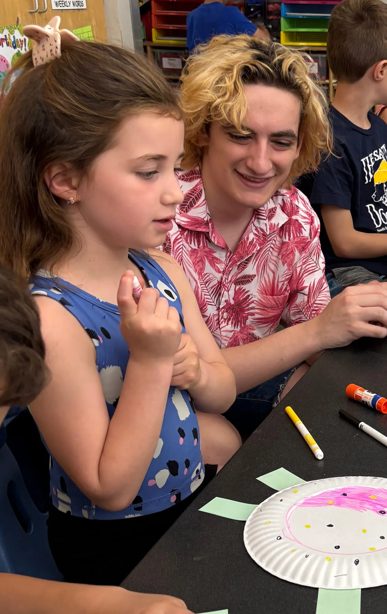 Winchester High School students teach first-graders about Galapagos tortoises