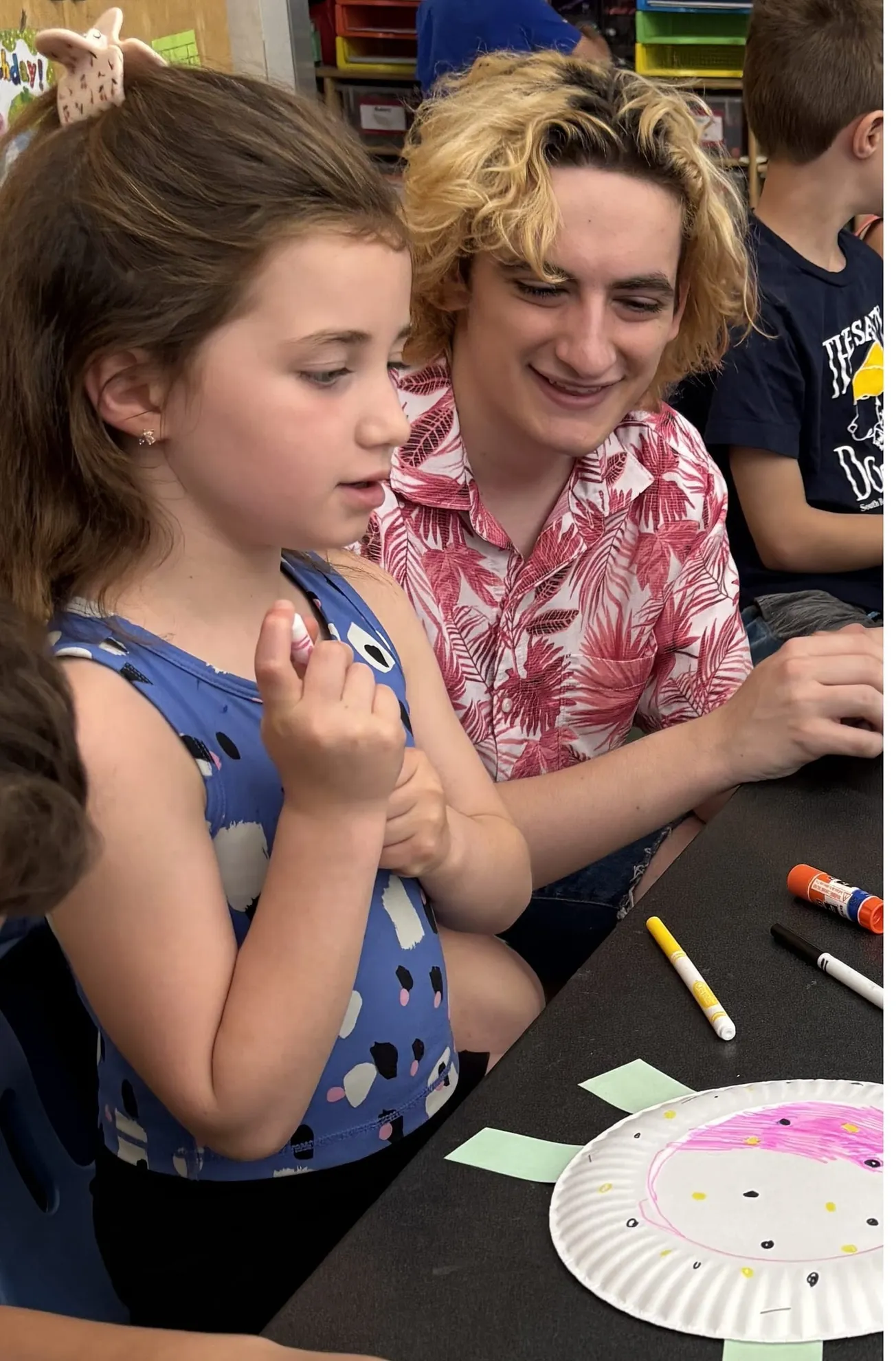 Winchester High School students teach first-graders about Galapagos tortoises