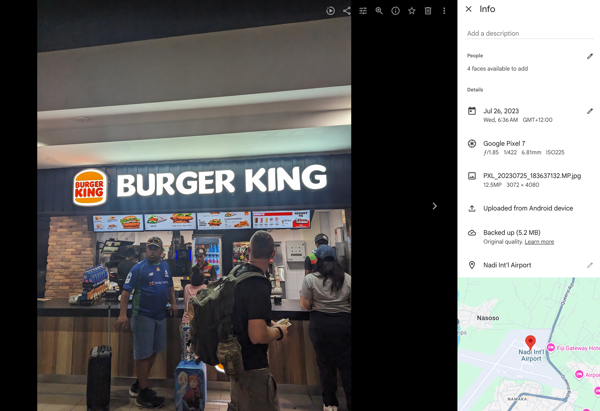 screenshot of a photo and the google photos sidebar. the photo is of the burger king in the nadi international airport in fiji. the date on the photo is july 26 2023.