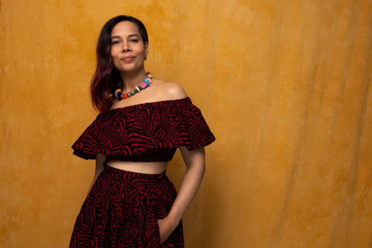 Rhiannon Giddens against a yellow backdrop