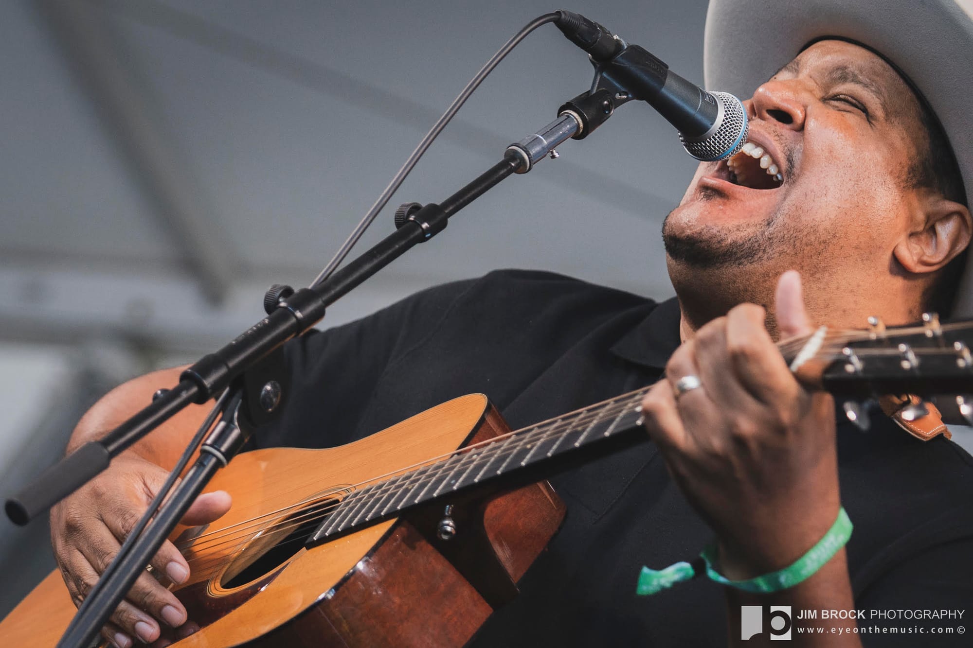 Chris Pierce sings and plays guitar onstage at Newport Folk Festival
